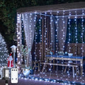 JMEXSUSS 900LED Christmas Curtain Lights Outdoor with Remote, 9.5x29.5ft White Christmas Lights Indoor Plug in, Hanging String Lights for Bedroom Wedding Backdrop Wall Window Xmas Decoration